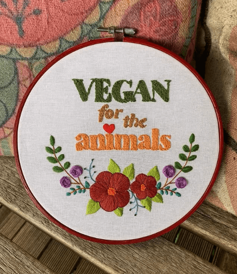 vegan yarn used in a craft project that reads "vegan for the animals"